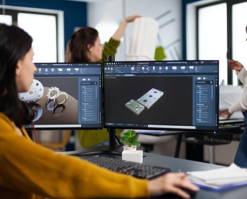 industrial-engineer-woman-working-at-pc-with-two-monitors-screens-showing-cad-software-q1rjdfxsta8esmo7kwfwzagth09dx3vwtmcjy8gx38
